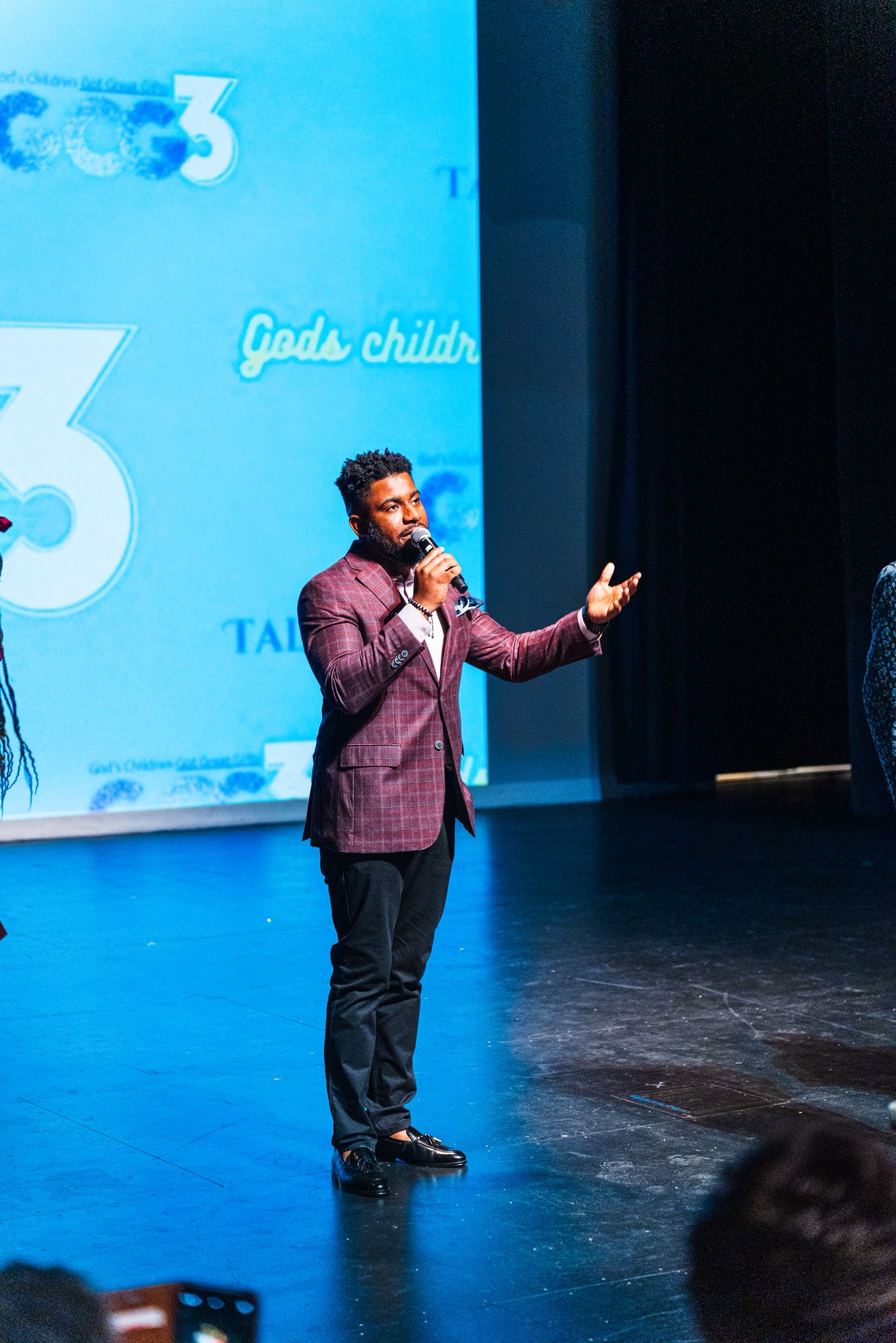 GCG3 MC presenting on stage